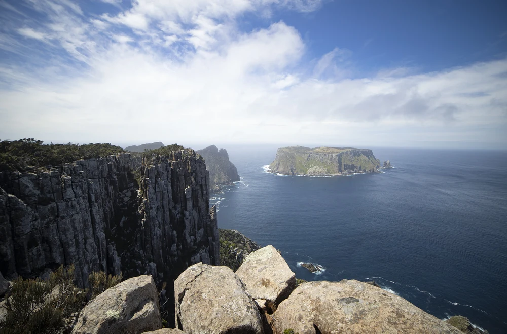 Rock formations in the ocean at Three Capes Track